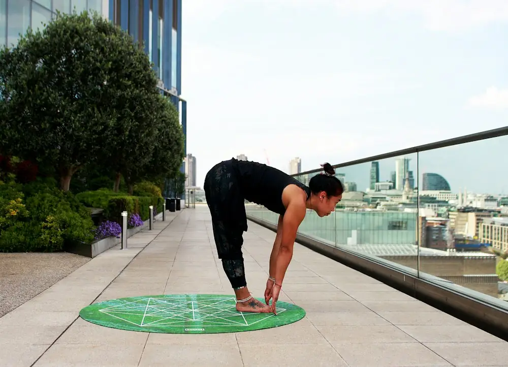 woman doing yoga touch her feet